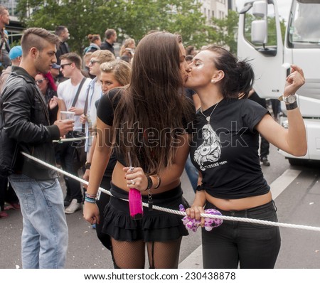 BERLIN, GERMANY - JUNE 21, 2014: Christopher Street Day. Crowd of people Participate in the parade celebrates gays, lesbians, and transgenders.