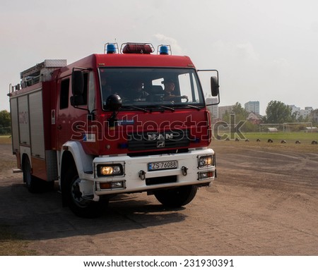 SZCZECIN, POLAND - JULY 08, 2014:Polish fire engine truck running during a mission