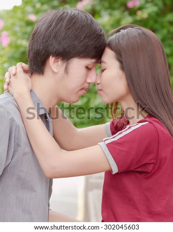 asia young couple in love park