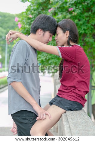 asia young couple in love park