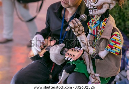 BANGKOK THAILAND : Jun 05 - asia men and puppet singing show on the streets Asiatique on BANGKOK THAILAND,Jun 05 2015