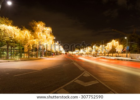 Abstract blurry car motion on road and tree lighting bokeh