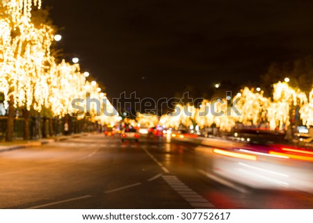 Abstract blurry car motion on road and tree lighting bokeh