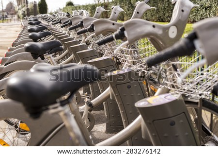 Looking down a row of rental bicycles in Paris France.