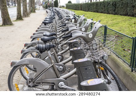 Bicycles parked at a rental station in Paris France.