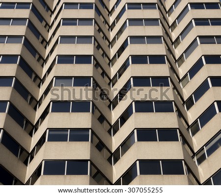 The outside of a building forms a geometric pattern.