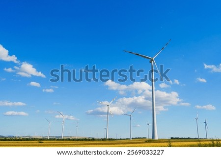 Similar – Image, Stock Photo Wind turbines with fluffy clouds