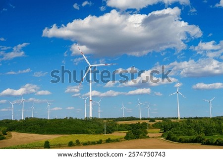 Similar – Image, Stock Photo Wind turbines with fluffy clouds