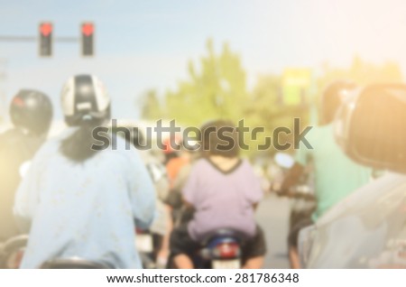 Blurred motorbike on traffic road abstract background.