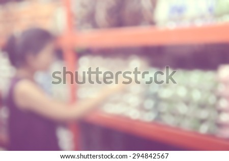 Blur woman shopping in shopping center mall abstract background.Retro color style.