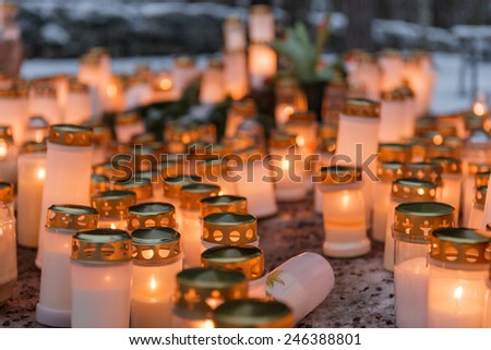 Candles in a cemetery in Finland during Christmas