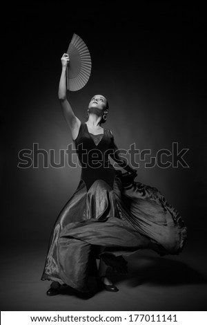 Black and white photo of young woman dancing flamenco