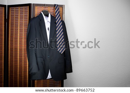 suit hanging on hangers