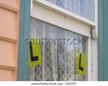 Learner signs on window.