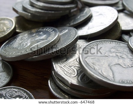 Australian coins on wooden table.
