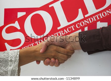 Business people seal contract for sale with a handshake.