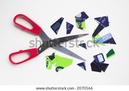 Bank cards cut up with scissors. Illustrates financial issues such as credit problems, bankcruptcy, budgeting and personal financial management.