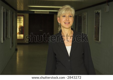Mature business woman in train station.