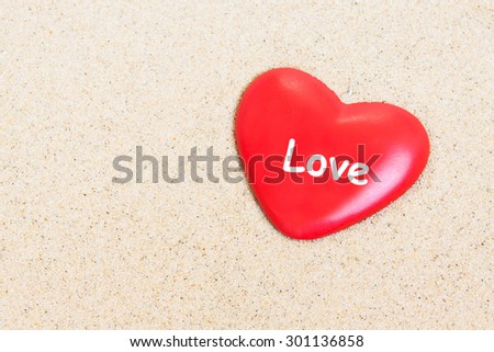 Heart on the sand  background.  Love wallpaper, greeting card.