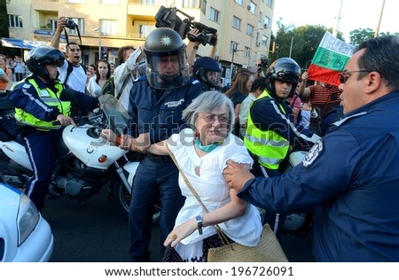 People in front of a police riot, during the ecological protest against construction work at the Bulgarian sea coast - Sofia, Bulgaria - 13, June 2012