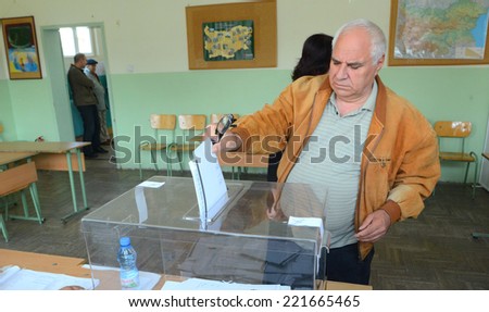 A man casts his vote at a polling station in Sofia October 5, 2014. Bulgaria