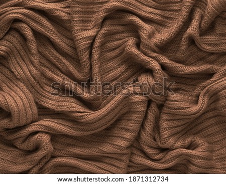 Similar – Image, Stock Photo Brown crumpled knitted scarf or sweater texture, top view. Texture background of warm crocheted clothing textile. Knitwear fabric.