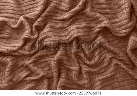 Similar – Image, Stock Photo Brown crumpled knitted scarf or sweater texture, top view. Texture background of warm crocheted clothing textile. Knitwear fabric.