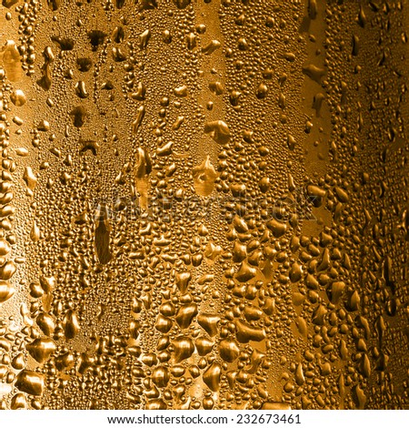 Drops of water on the cooler,Gold color background.