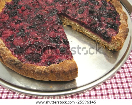 Cutted berry cake on a cake tray