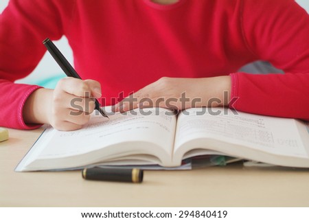 girl writing in correct posture