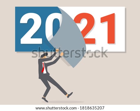 Goodbye 2020. A businessman tears off a calendar sheet of the outgoing year. Parting with coming year.