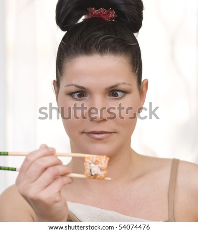 Woman with sushi california roll