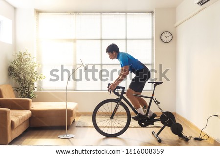 Similar – Image, Stock Photo Female cyclist stretching legs on street