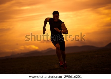 Asian men are siluate jogging at a speed in the evening