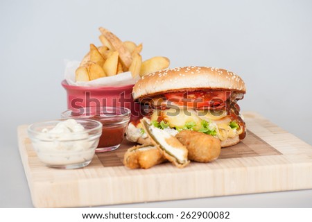 special hamburger with two sauces , cheese and fries