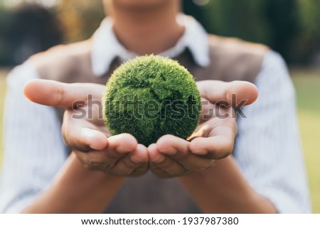 Asian teenager showing earth on hand, ecology and environment sustainable concept. Stock foto © 