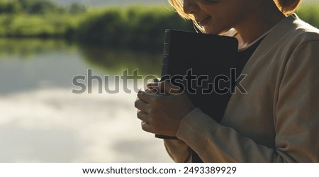 Similar – Image, Stock Photo A happy teenager is texting on a mobile phone, lying on the floor in the living room. Modern technologies, online communication