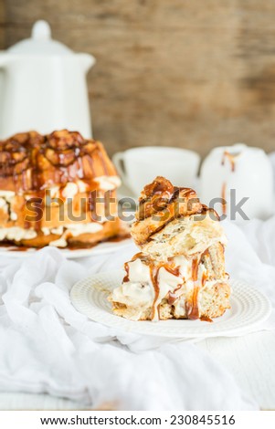 Cinnamon roll cake with caramel sauce, selective focus