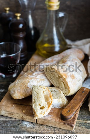 Italian bread chiabatta with wine and olive oil, selective focus