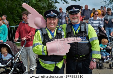 BRIDGEND, UK - JUNE 1: Community Support Police Officers at Race for Life Event on June 1, 2014 at Newbridge Fields in Bridgend, UK.