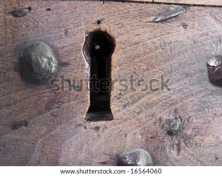 warded lock in an ancient wooden door