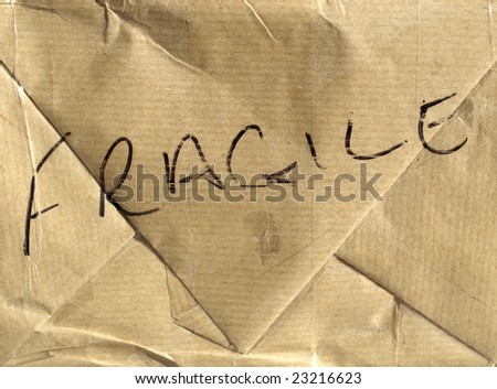Fragile (handle with care) brown corrugated cardboard packet
