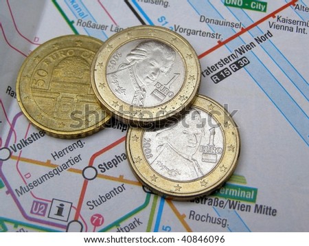 Austrian Euro coins over Vienna underground map
