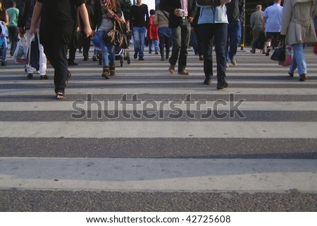 people crossing the street in London