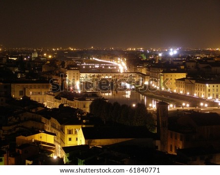 Florence by night - bird eye\'s view from San Miniato al Monte over the river Arno, including Ponte Vecchio