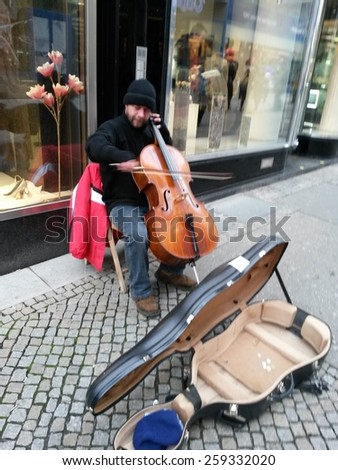 VIENNA, AUSTRIA - CIRCA DECEMBER 2014: unidentified street cello player