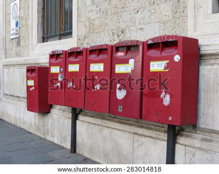 SIENA, ITALY - CIRCA DECEMBER 2014: row of letter box mailboxes for sending mail