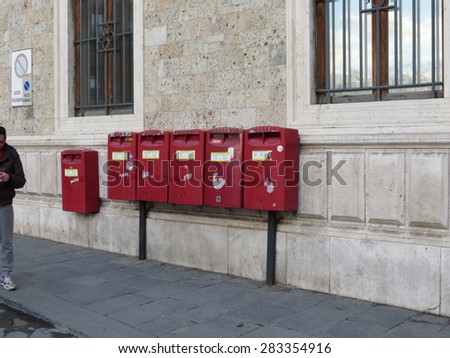 SIENA, ITALY - DECEMBER 19, 2014: row of letter box mailboxes for sending mail