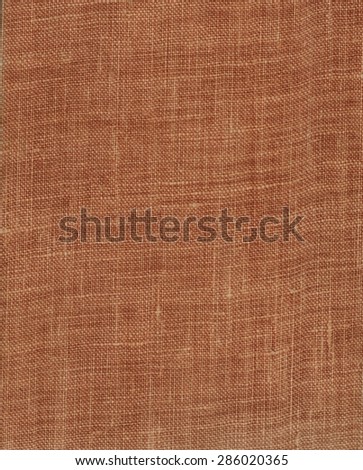 brown or dark red cloth book binding useful as a background