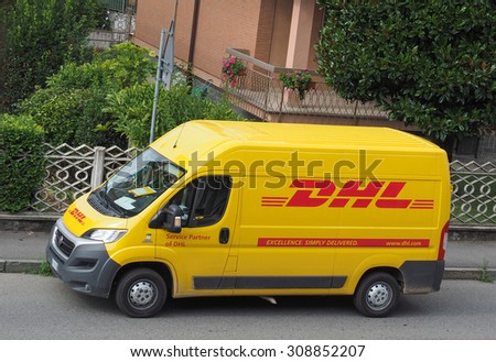 MILAN, ITALY - CIRCA AUGUST 2015: DHL van parked on a street. DHL is a world wide courier company that operates in 220 countries with over 285,000 employees